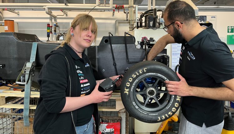 Prospective engineers from the FaSTDa team assemble the cooling system in NORMA Group's prototype construction.
